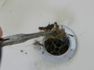how to fix garbage disposal clogged
