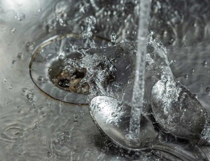 how to remove spoon stuck in garbage disposal